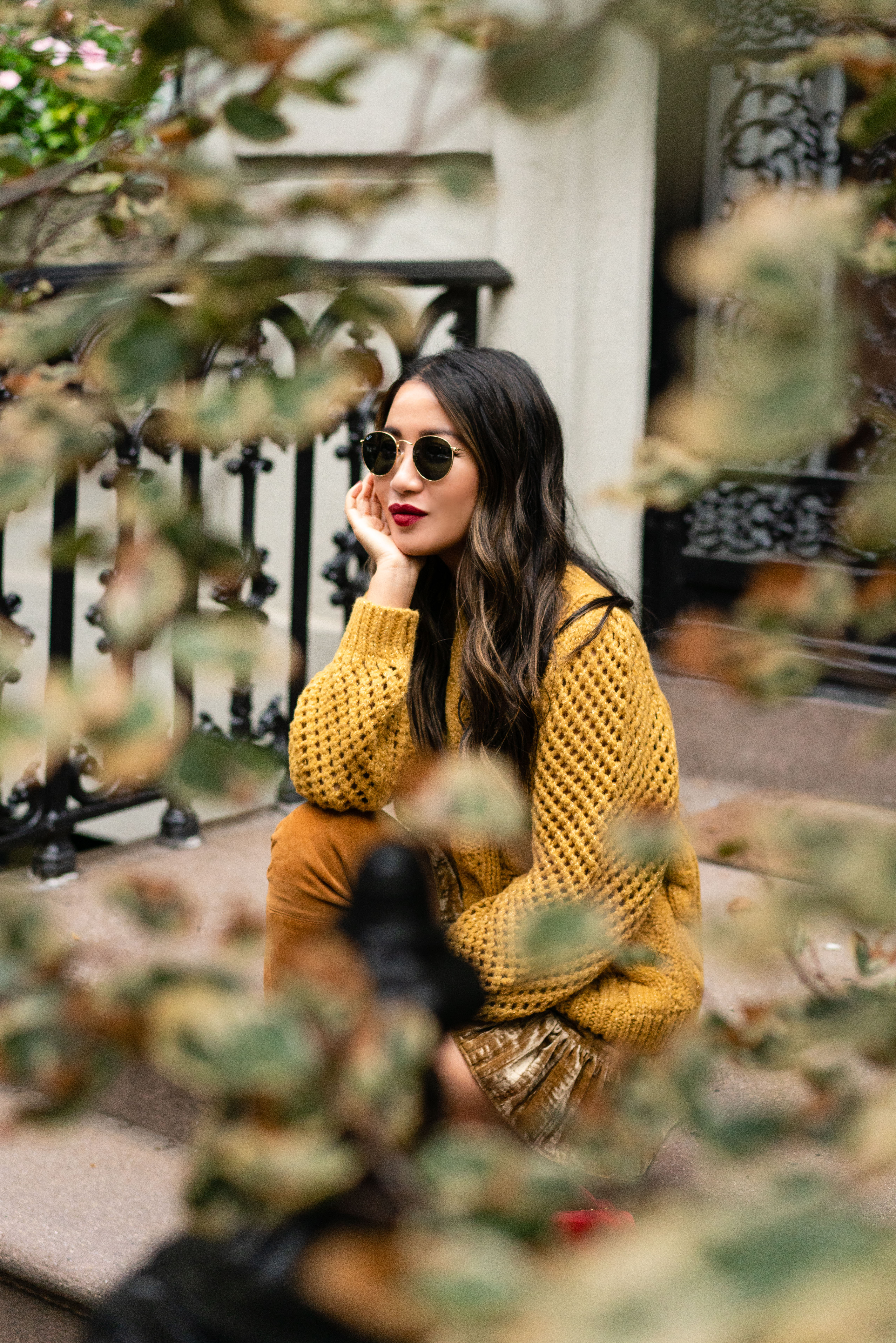 Wearing yellow sweater, yellow skirt, and red lipstick fall fashion outfit
