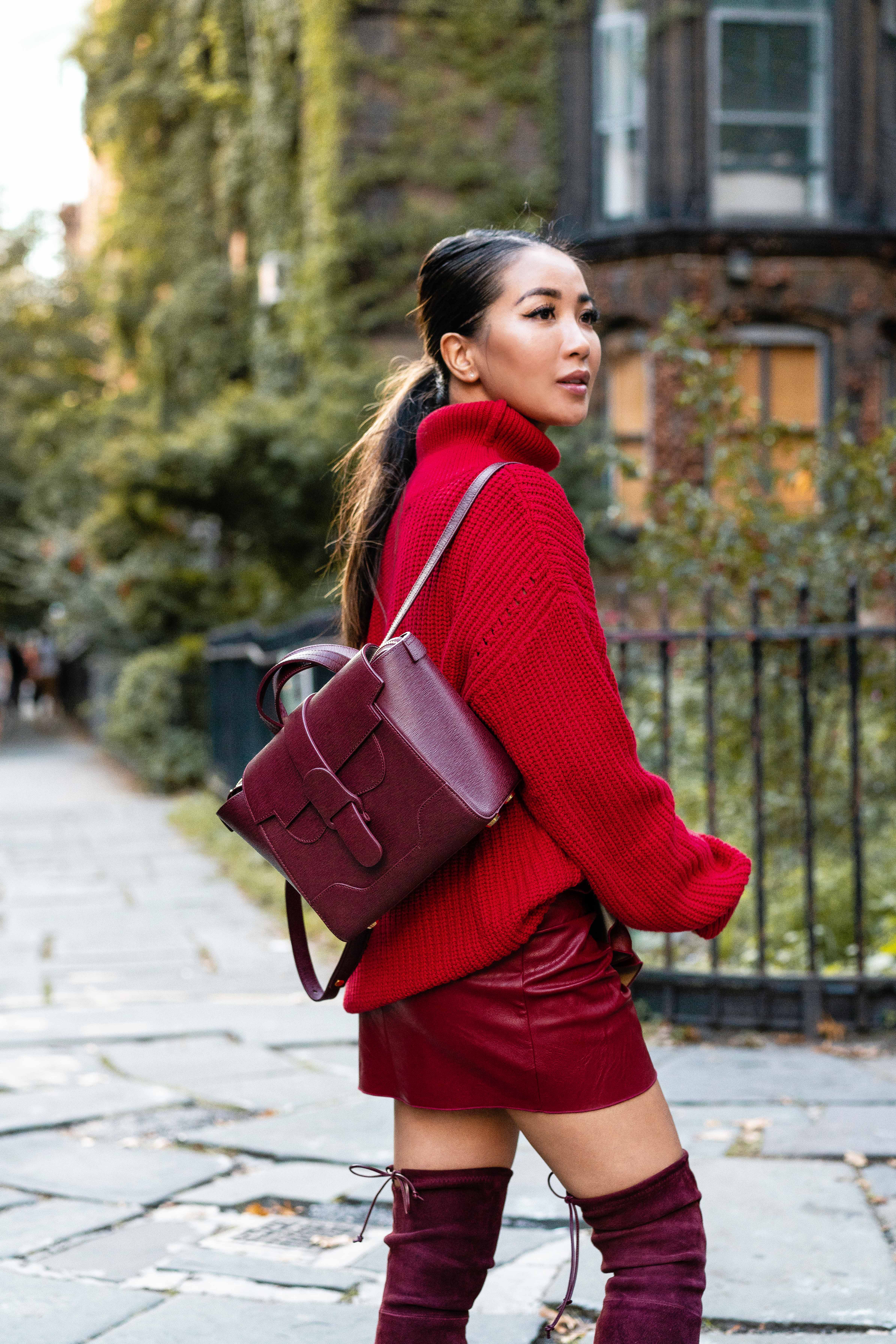 Fall outfits in red sweater red skirt red Stuart Weitzman boots and Senreve bag